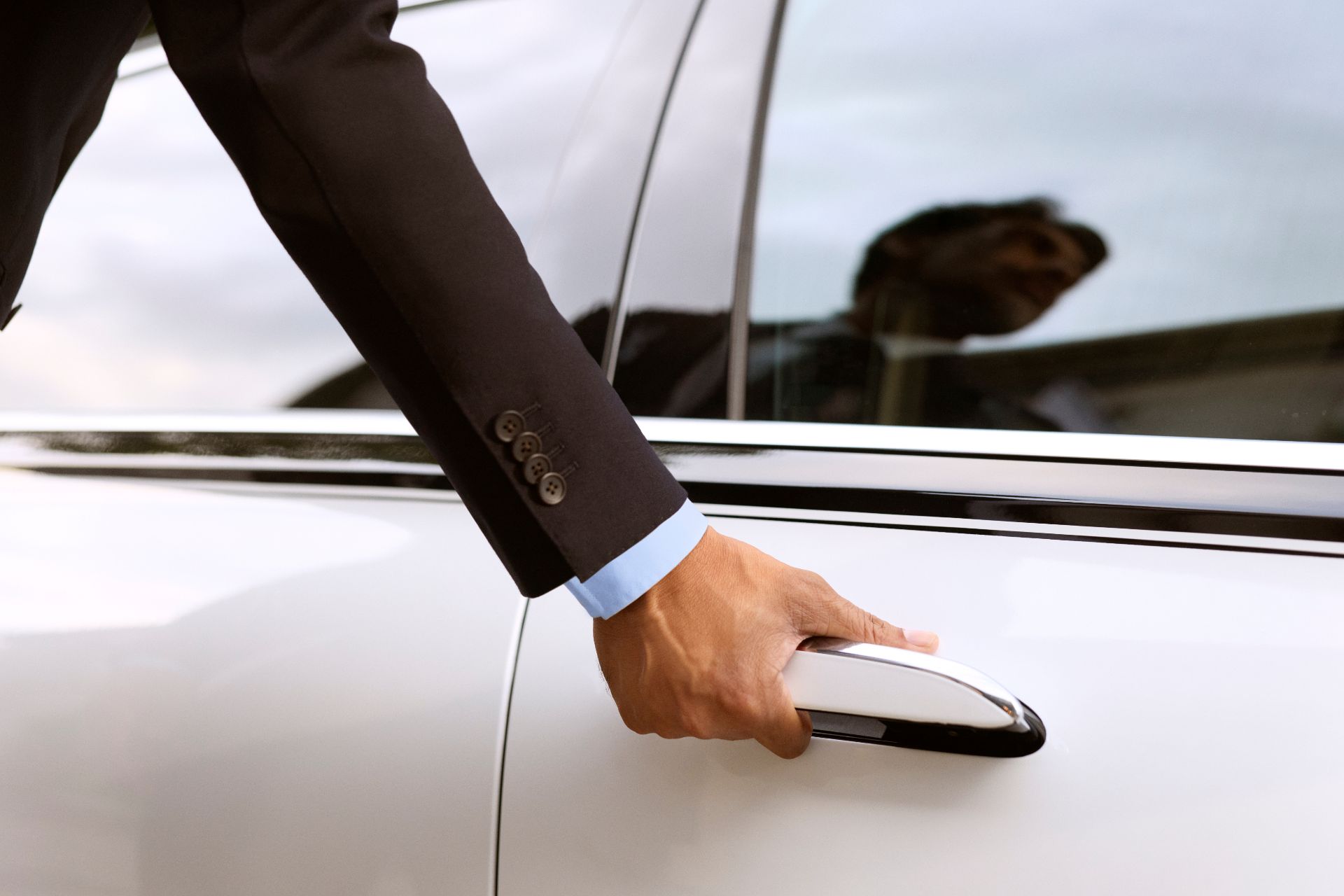 Chauffeur opening car door